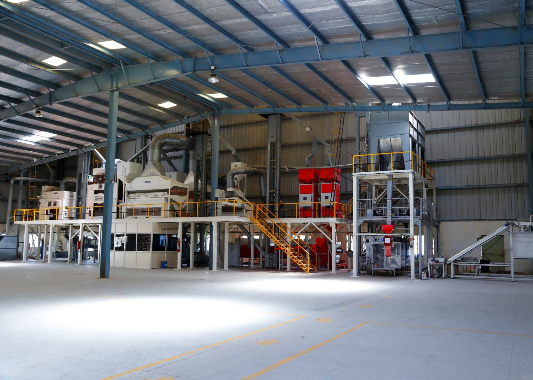 Warehouse with processing line and finished stock